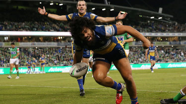 Isaiah Papali’i celebrates after scoring a try in Canberra.