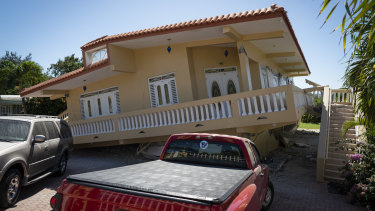 A house in Guayanilla, Puerto Rico, is knocked off its foundations by Tuesday's earthquake. 