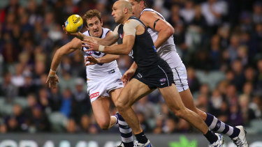 Former Carlton and West Coast champion Chris Judd in full flight against the Dockers.