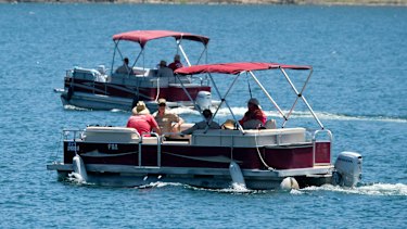 Members of the Ventura County Sheriff's Office on the lake on Monday.