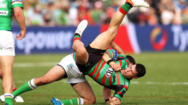 South Sydney’s Lachlan Ilias is flipped in a tackle.