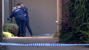 Forensic officers at the Park Street apartment block.