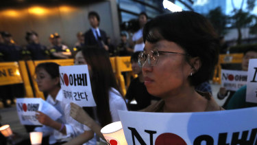 South Koreans protest the Japanese government's decision on their exports to South Korea in front of the Japanese embassy in Seoul.