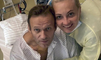 Alexei Navalny, pictured with his wife Yulia, is recovering in a German hospital.