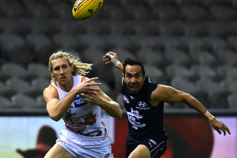 Eddie Betts of the Blues and Nick Haynes of the Giants compete for the ball.