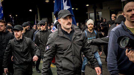 Thomas Sewell leads blackclad NSN members into the anti-immigration ‘March for Australia’ rallies he secretly organised in August.