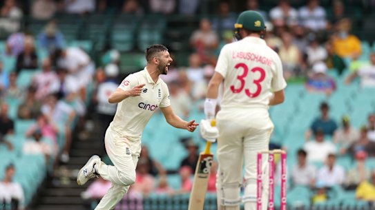Mark Wood takes Marnus Labuschagne’s wicket on day one in Sydney. 