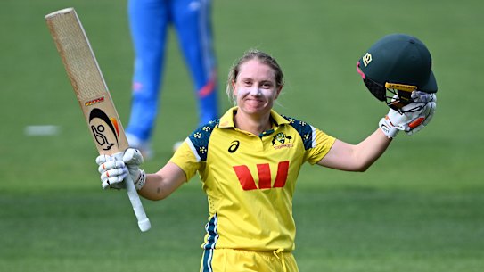 Alyssa Healy of Australia celebrates getting to her century.