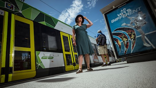 Krista Milne, co-chief heat officer at the City of Melbourne, on the platform at the Australian Open covered in a special cooling treatment. 