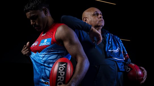 Kysaiah Pickett with his dad, Kevin Kropinyeri, who designed the Demons’ Indigenous jumper.
