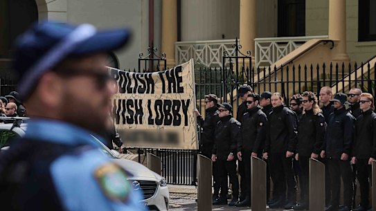 Thin blue line meets thick black line: the rally outside Parliament House on Saturday.