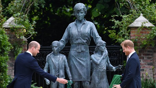 Prince William and Prince Harry take the covers of the new Kensington Palace statue.