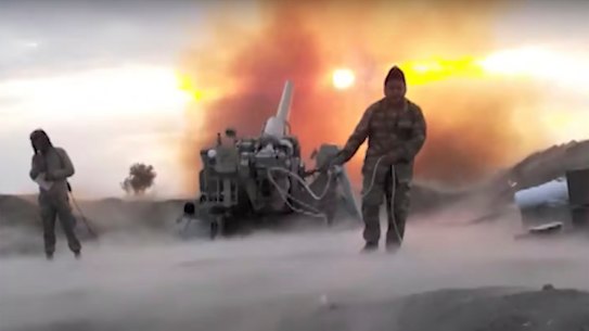 Azerbaijan army soldiers fire an artillery piece during fighting with forces of the self-proclaimed Republic of Nagorno-Karabakh. 
