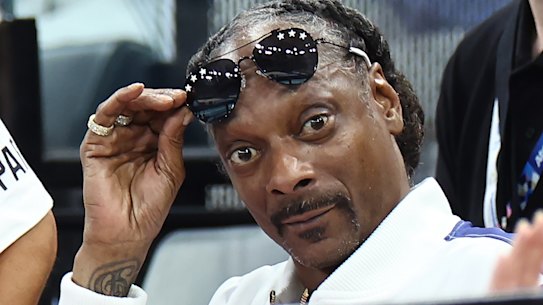 Snoop Dogg watches the gymnastics.