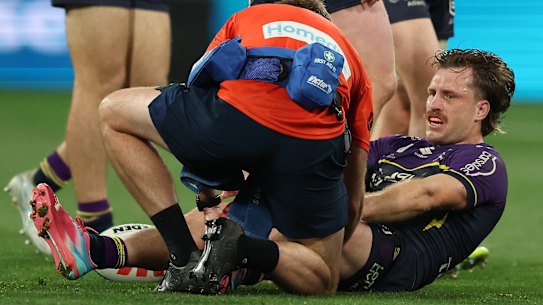 Cameron Munster of the Storm is treated after going down injured.