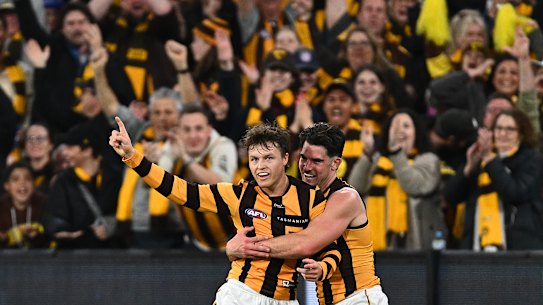 Jack Ginnivan of the Hawks is hugged by Jai Newcombe as they celebrate a goal in the final term.