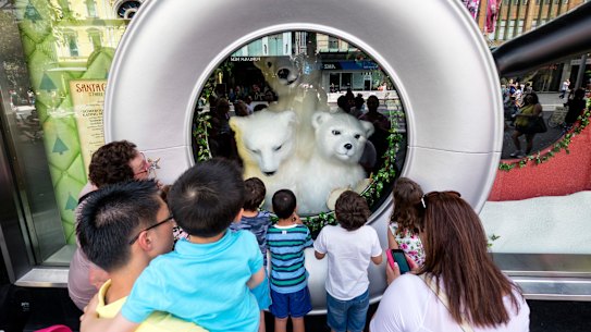 Children looking at the Myer Christmas window display in Melbourne in 2018.