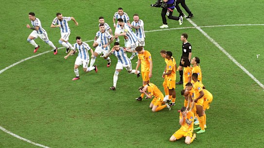 LUSAIL CITY, QATAR - DECEMBER 09: Argentina players celebrate after their win in the penalty shootout as Netherlands players react during the FIFA World Cup Qatar 2022 quarter final match between Netherlands and Argentina at Lusail Stadium on December 09, 2022 in Lusail City, Qatar. (Photo by Elsa/Getty Images)