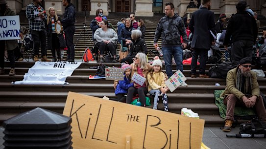 Protesters against the Victorian government’s proposed pandemic laws gather outside State Parliament.
