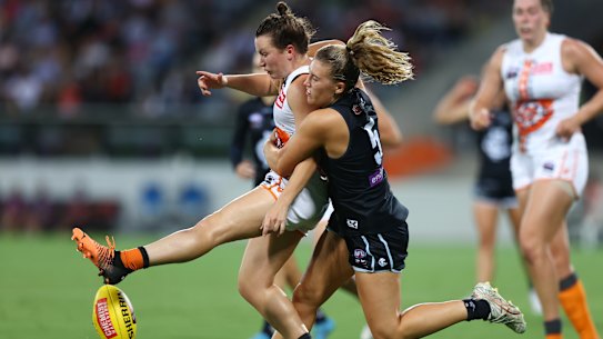 CANBERRA, AUSTRALIA - FEBRUARY 27: Abbie McKay of Carlton tackles Alyce Parker of the Giants during the round eight AFLW match between the Greater Western Sydney Giants and the Carlton Blues at Manuka Oval on February 27, 2022 in Canberra, Australia. (Photo by Mark Nolan/Getty Images)