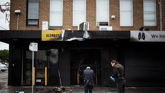Police inspect the damage at Glenroy Convenience following an attack on March 29