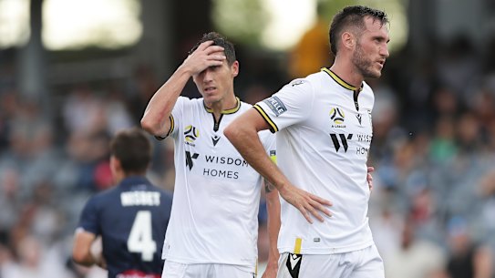 Mark Milligan and Aleksandar Susnjar after the Mariners' second goal condemned Macarthur FC to a first A-League defeat.