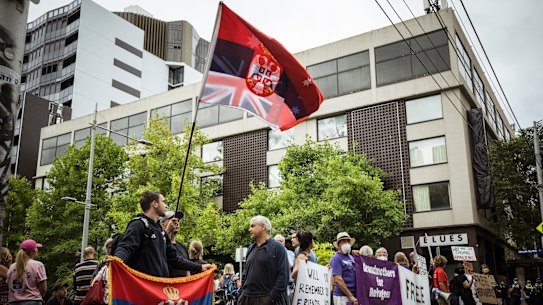 Protesters and Novak Djokovic supporters gather outside Carlton’s Park Hotel in Melbourne on Friday afternoon.