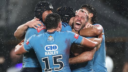 James Tedesco celebrates the match-winning try.