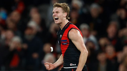 Hobbs celebrates a goal against Adelaide.