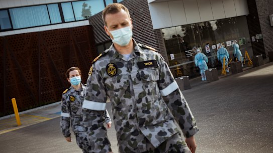 ADF troops help health workers at Epping Gardens Aged Care in Melbourne on Tuesday.
