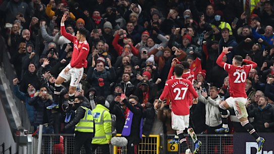 Cristiano Ronaldo celebrates what proved the winner and his second goal against Arsenal at Old Trafford.