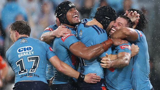 NSW players celebrate James Tedesco's match-winning try.