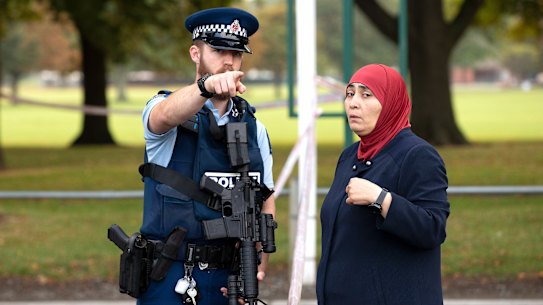 New Zealand police patrol the scene of last week's Christchurch massacre.