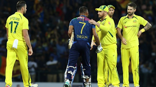 Sri Lankan captain Dasun Shanaka is congratulated by Australian captain Aaron Finch after winning the final match of the T20 International series between Sri Lanka and Australia.