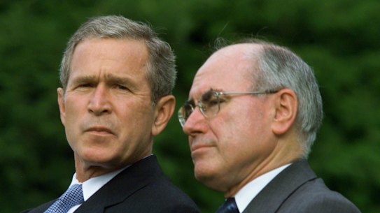 John Howard (right) alongside US president George W. Bush, took Australia to war in Iraq in 2003.