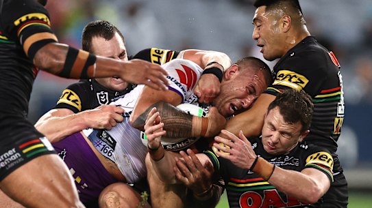 Nelson Asofa-Solomona of the Storm is tackled.