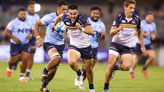 Tom Wright making a break for the Brumbies against NSW.