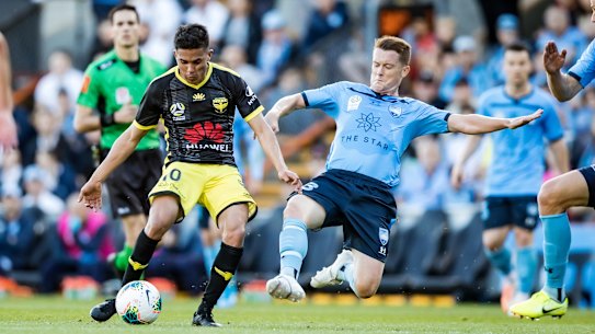 Brandon O'Neill dives in for a tackle on Wellington's Ulises Davila last year.