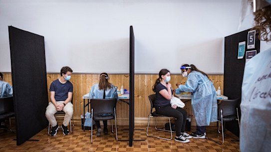 Kanella Pirpiris, 16, and Panos Menidis, 20, getting their COVID-19 vaccination at the pop-up site in Thornbury. 