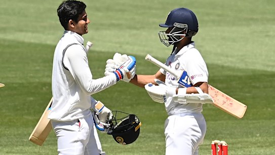 Shubman Gill and Ajinkya Rahane celebrate after India's victory in the second Test on Tuesday.