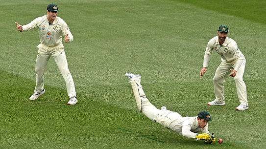 One that got away: Captain Tim Paine spills a chance during a frustrating day for the Australian team.