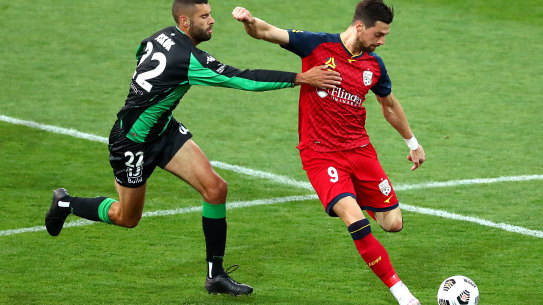 Tomi Juric (right) is keen to make an impact at Adelaide and reclaim a spot in the Socceroos line-up.