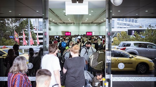 Large queues formed at Melbourne Airport’s terminal 3 departures on Tuesday.
