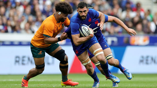 Charles Ollivon, of France, is tackled by Australia’s Rob Valetini.