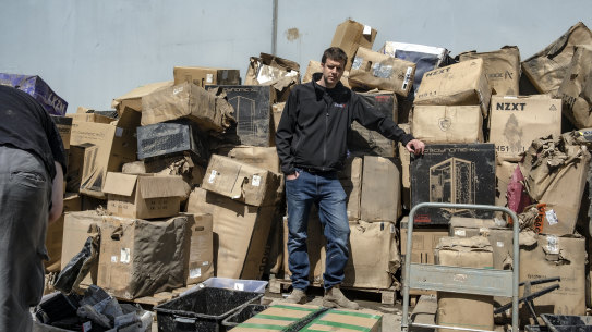 Aftershock PC co-owner Richard Noble pictured in October  after the flood with a pile of damaged stock.