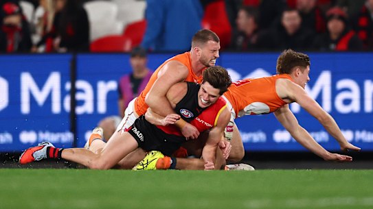 Kieren Briggs of the Giants tackles Sam Durham of the Bombers.