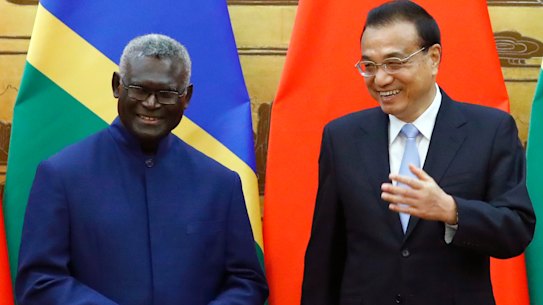 Solomon Islands Prime Minister Manasseh Sogavare with Chinese Premier Li Keqiang in Beijing in October 2019.