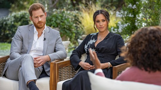 Prince Harry, from left, and Meghan, Duchess of Sussex, in conversation with Oprah Winfrey. 