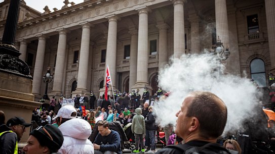 Protesters gather at Parliament House on Tuesday.