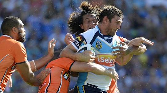 Titans forward David Taylor takes on the Tigers in 42-degree heat on the Gold Coast in March 2014.